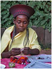 zulu woman making bead jewelry